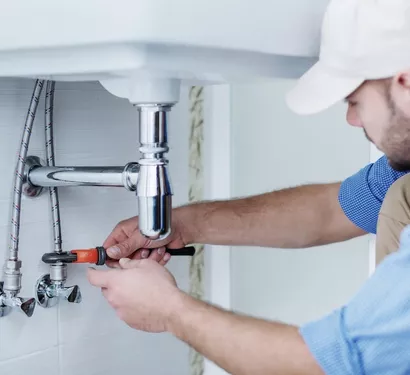 Bathroom plumbing inspection in a Tempe property
