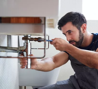 Fixing a leaking bathroom pipe in Tempe