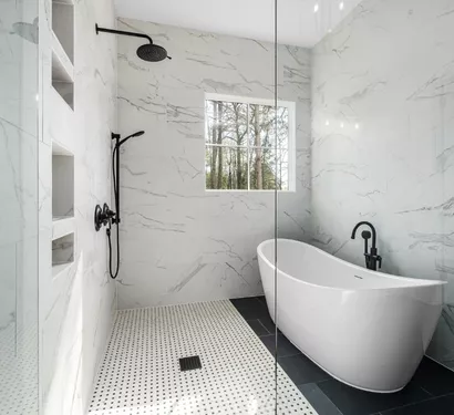 Plumber repairing bathroom fixtures in a Tempe home