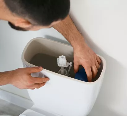 Installing a new toilet in a Tempe bathroom